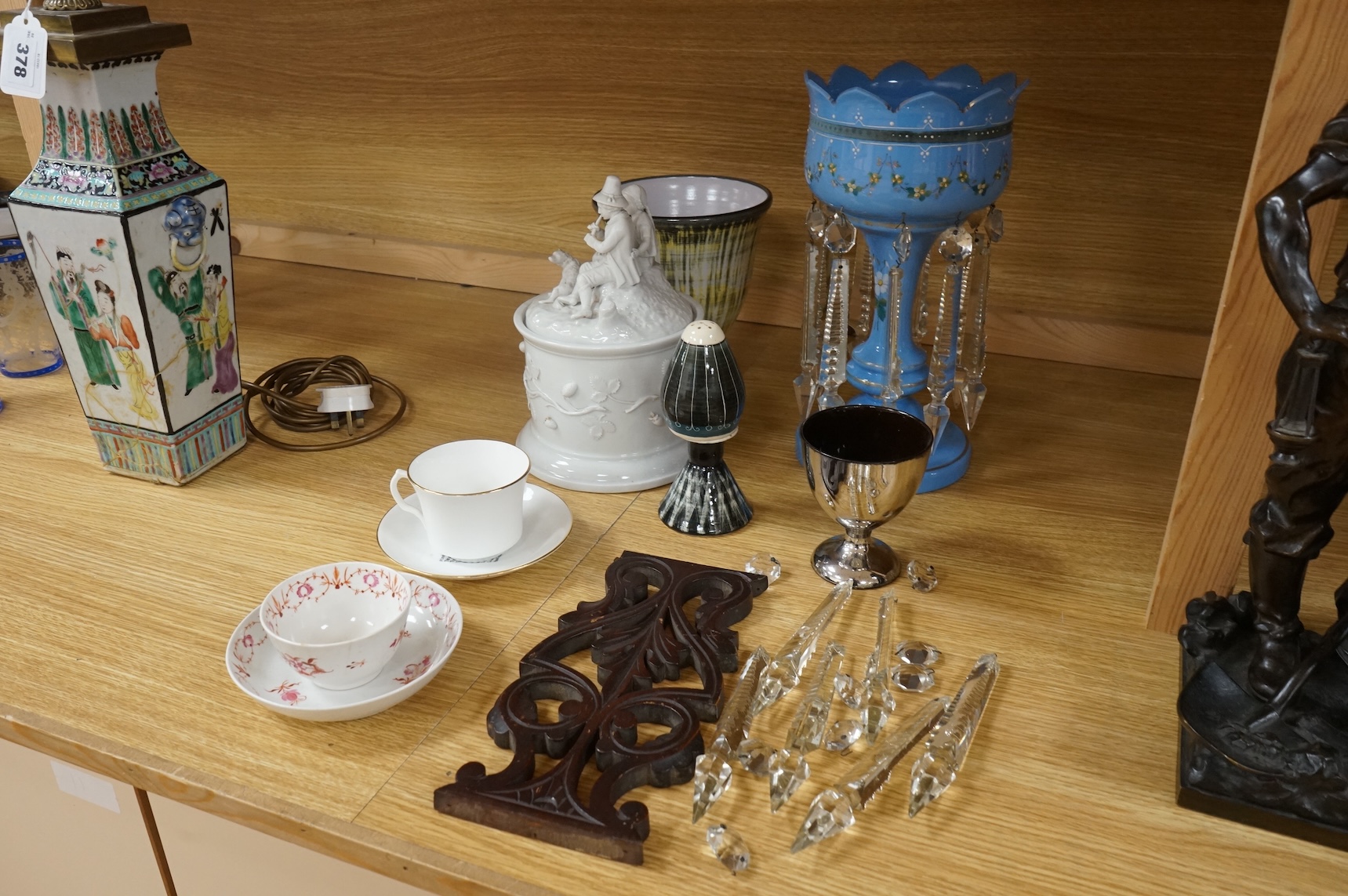 A collection of ceramics and glassware to include a lustre with drops, a bisque figure group and 19th century tea bowl and saucer